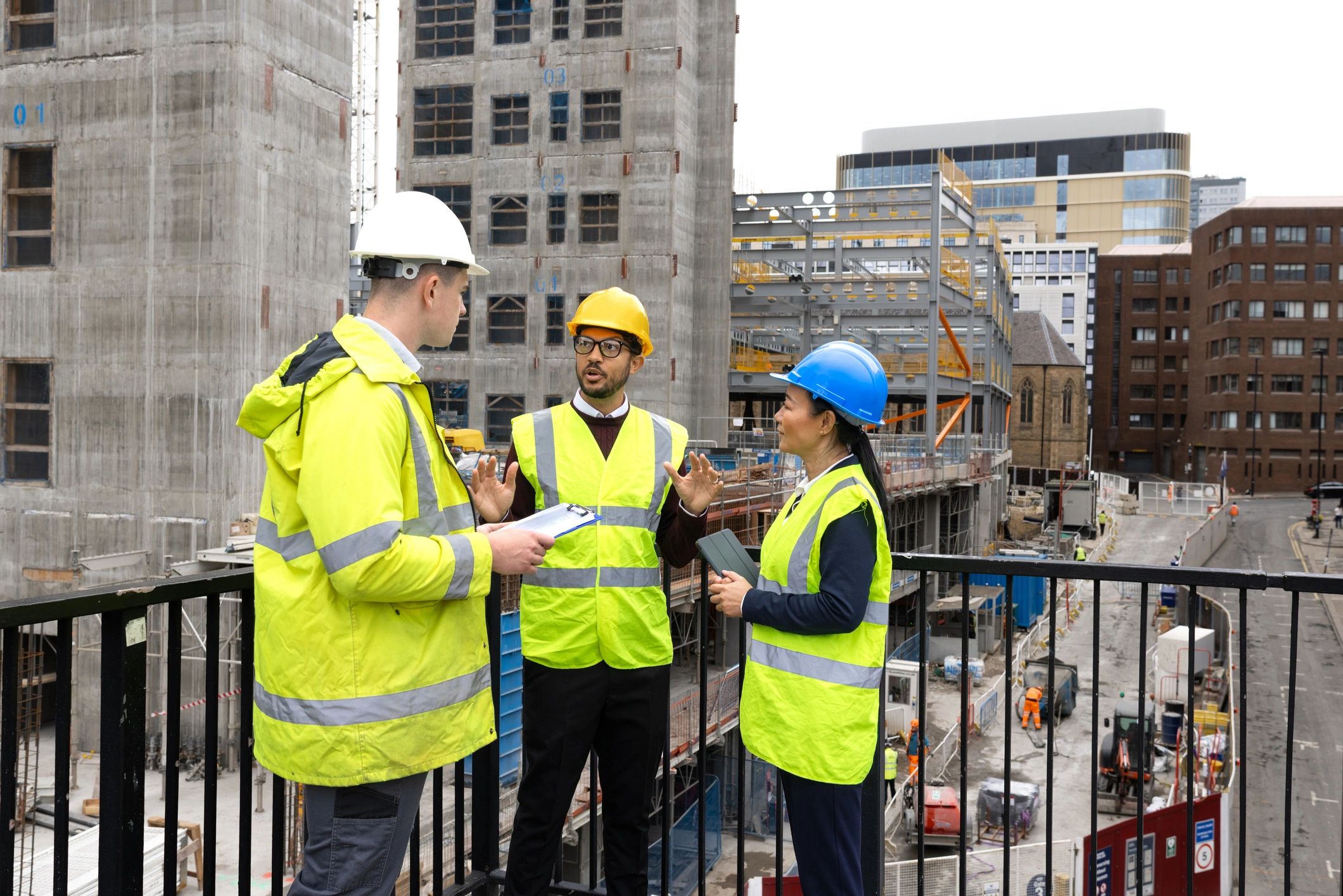 Construction team reviewing plans during a site inspection